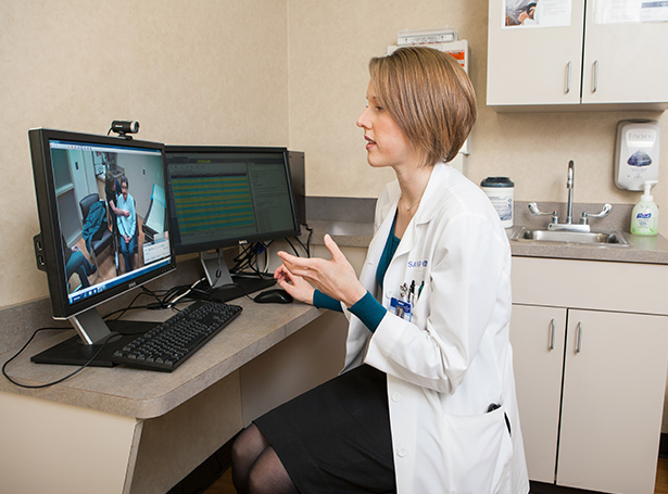 A doctor at her computer