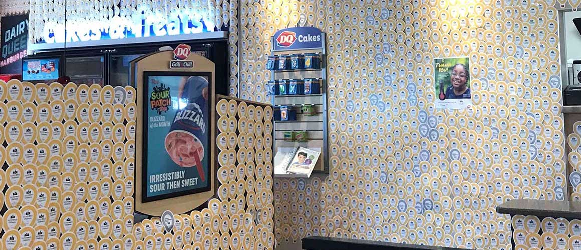 Inside of Dairy Queen location with the walls completely covered in balloon icons