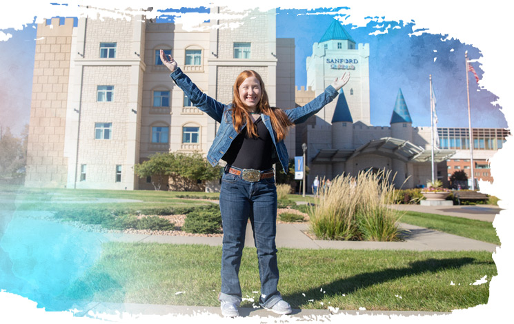 girl standing outside of children's hospital