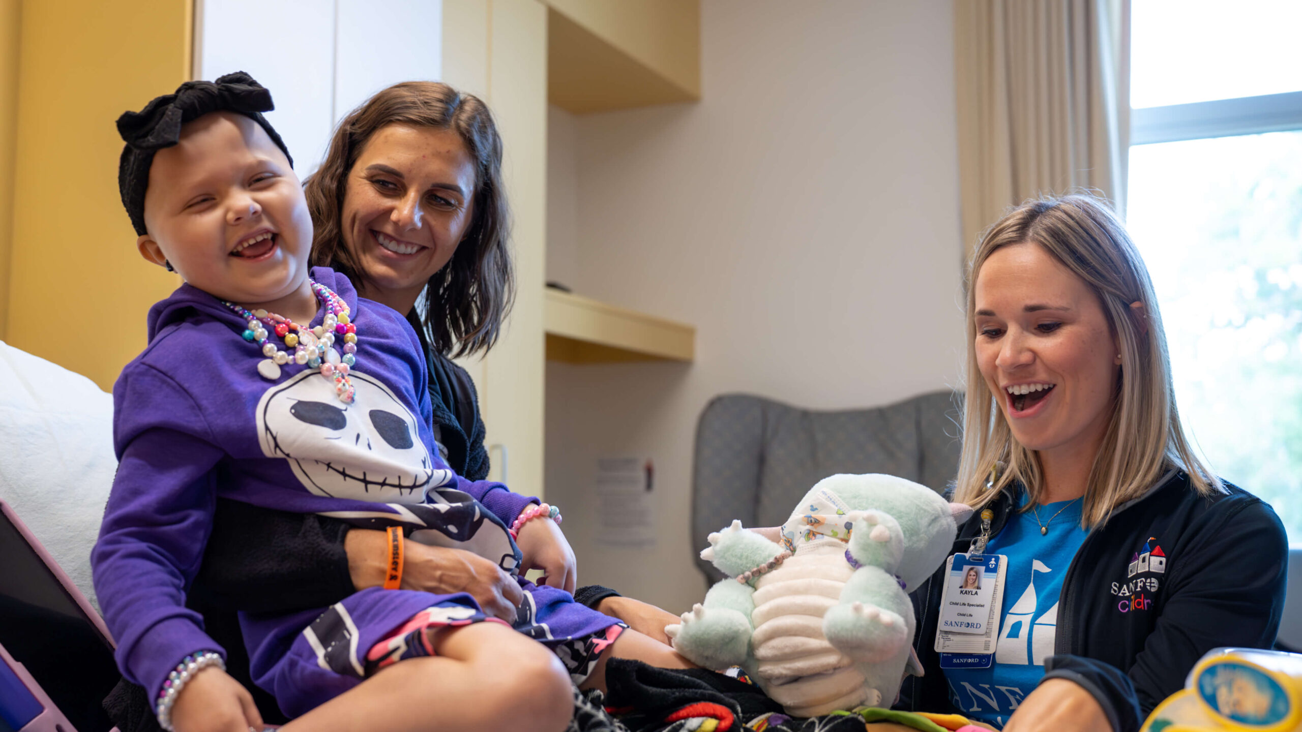 Kinsley with a Child Life Specialist